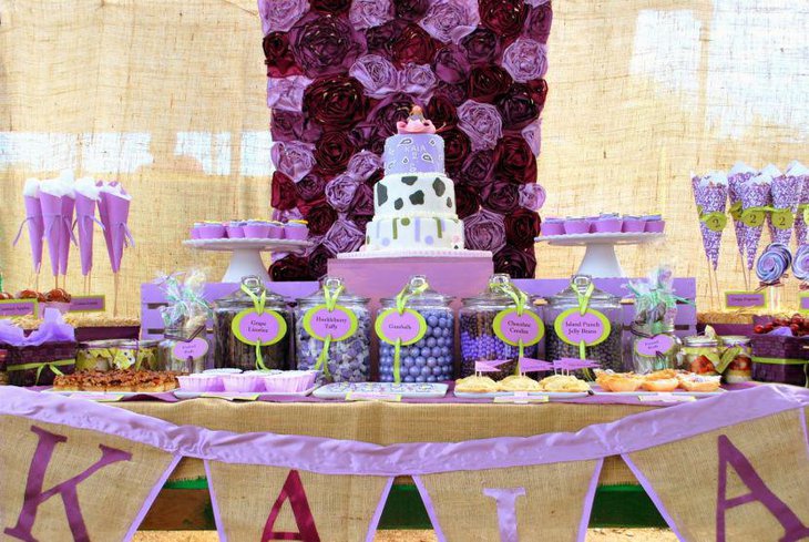 Party dessert table decoration with purple