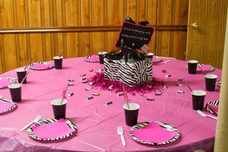 Pink and black adult birthday table with a show quote