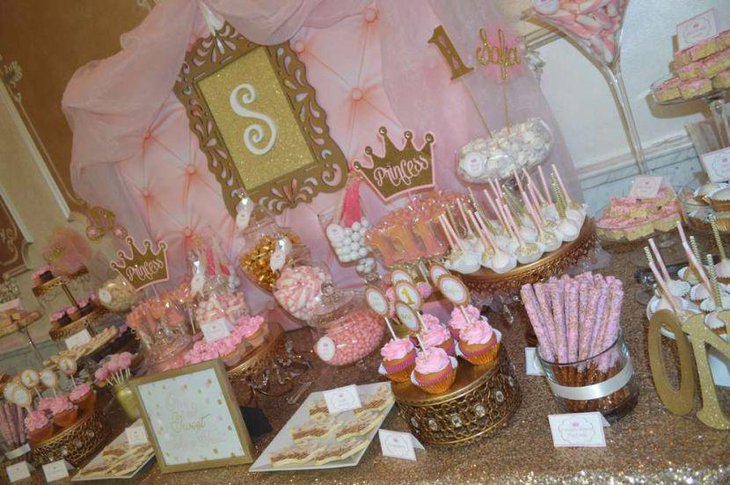 Pink and gold Princess themed baby shower candy table