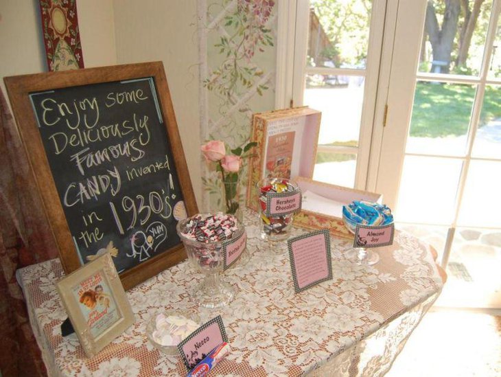 Pink and pastel decorations on grandmas 80th birthday candy table