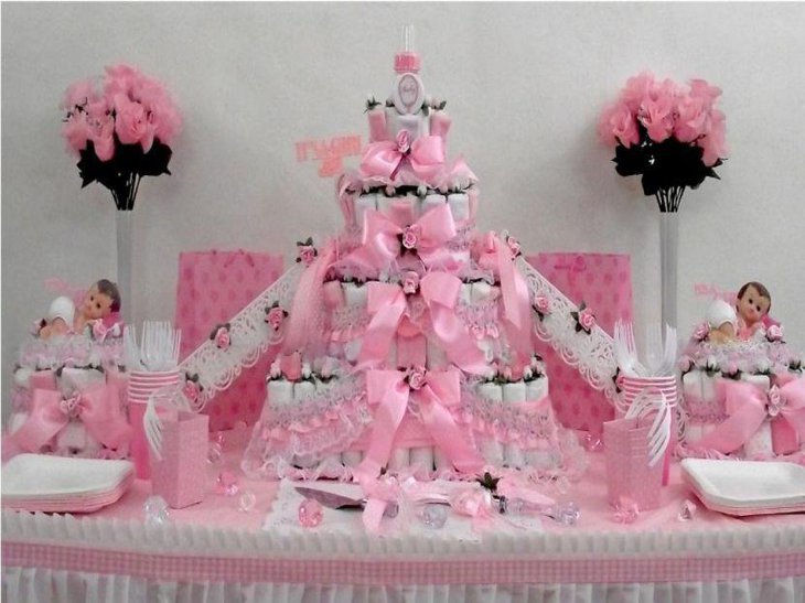 Pink and white diaper cake for twins