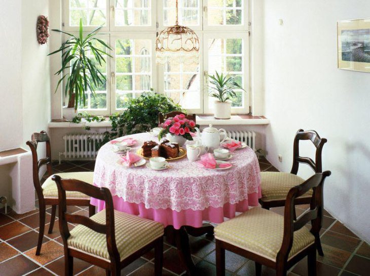 Pink floral decor on a small breakfast table