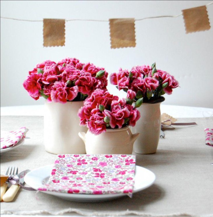 Pink flower decor on kids birthday table