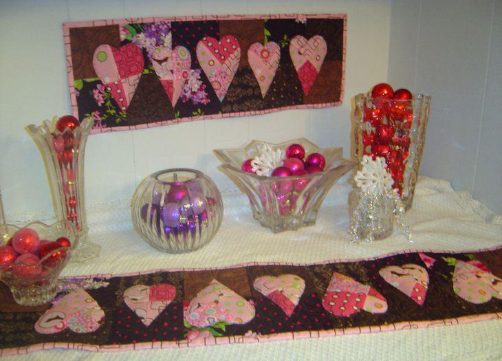 Pink heart patterns on quilted Valentines table runner