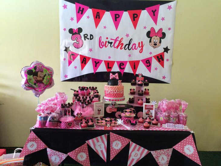 Pink Minnie Mouse themed candy buffet tablescape