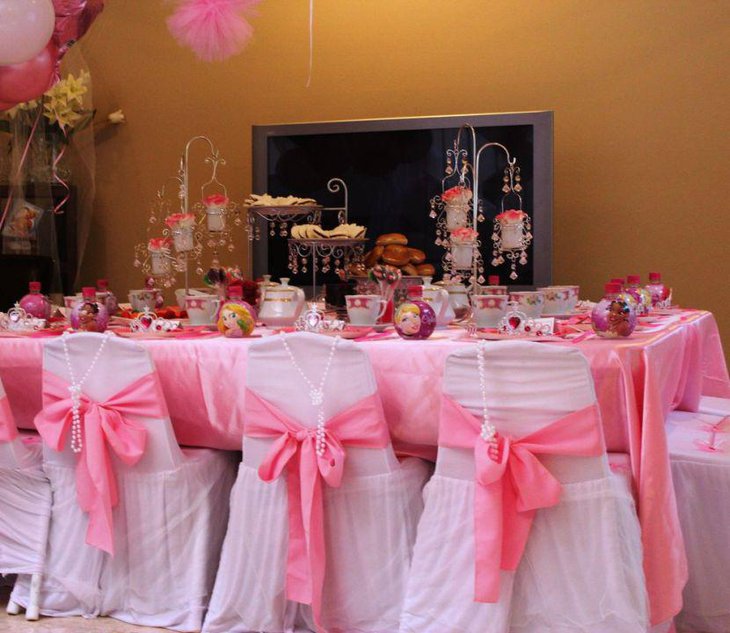 Pink tea party themed birthday party table decor