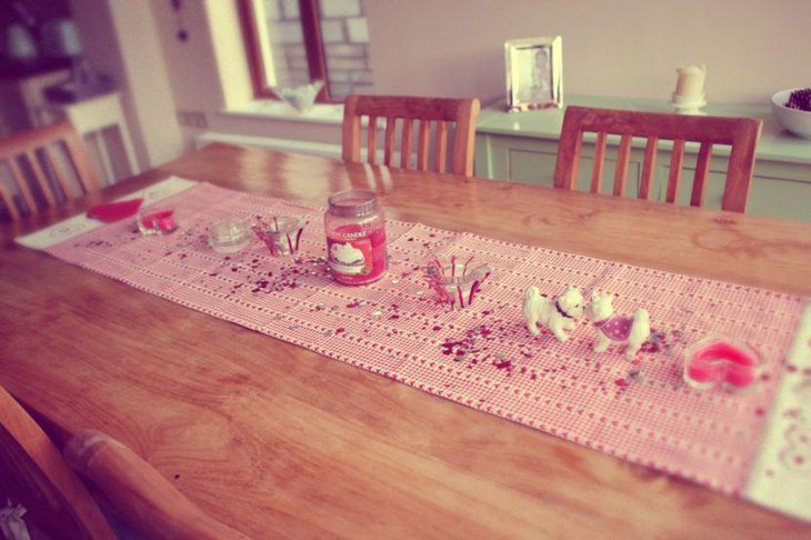 Pink Valentine table runner with small heart patterns