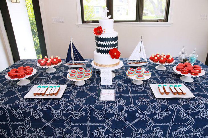 Pretty blue nautical themed dessert table design with boats