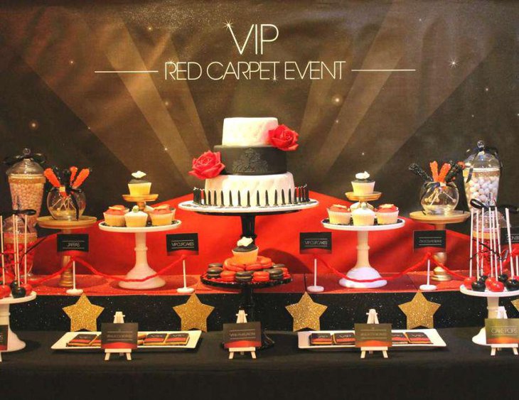 Red Carpet themed dessert table decked in tones of red and gold
