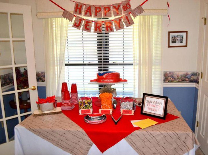 Red themed 80th birthday table decor for a dad