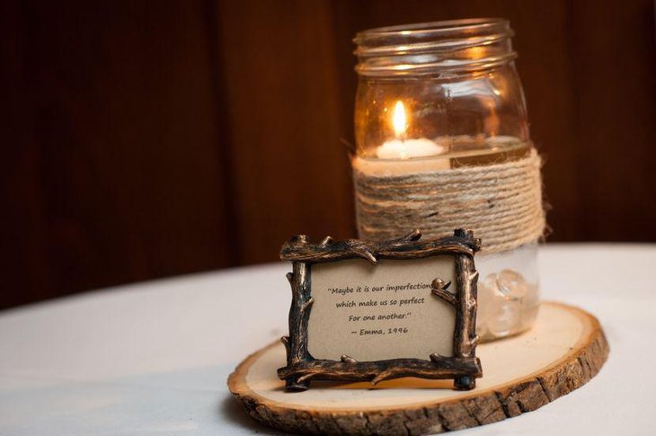 Rustic mason jar with candle centerpiece on wedding table
