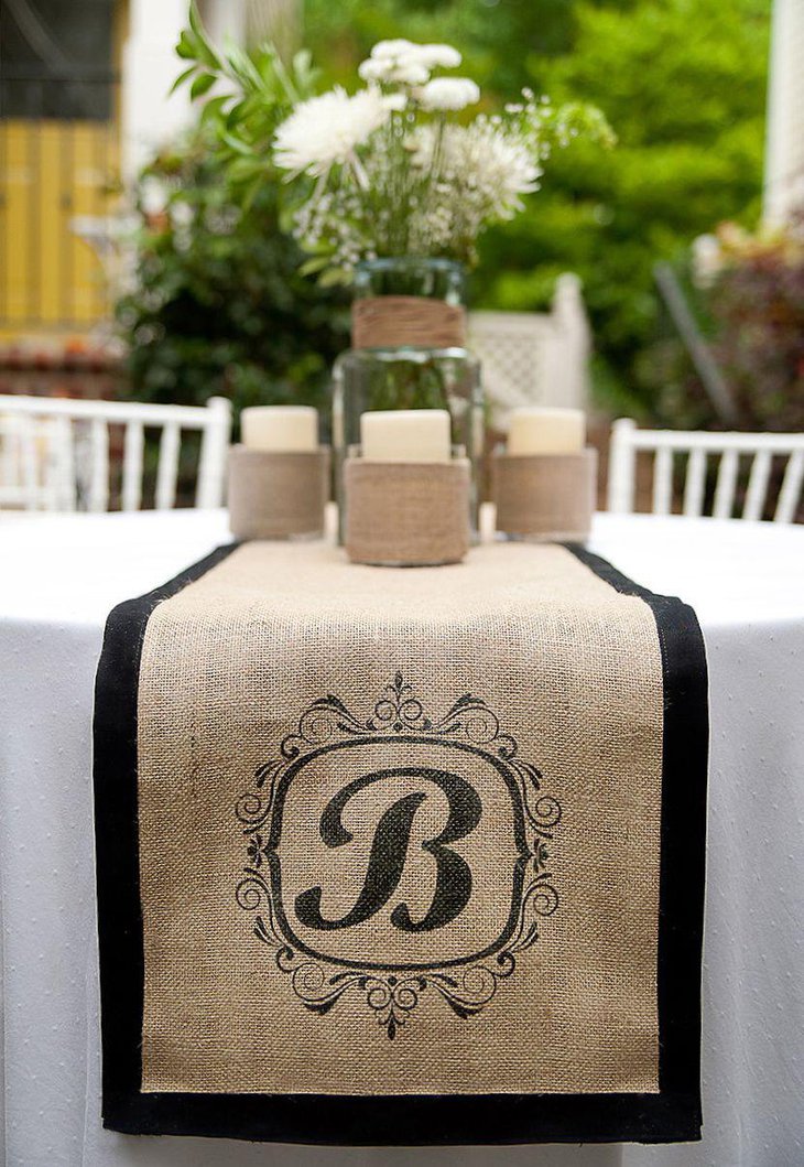 Rustic Wedding Table Centerpiece With Burlap Runner and Twine Wrapped Candles