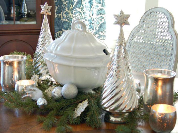 Silver Christmas trees votives and balls on greens vignette