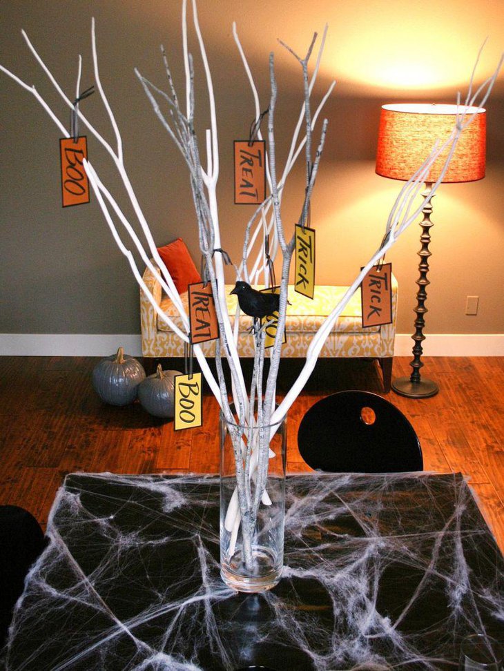 Simple Halloween branch centerpiece with a raven