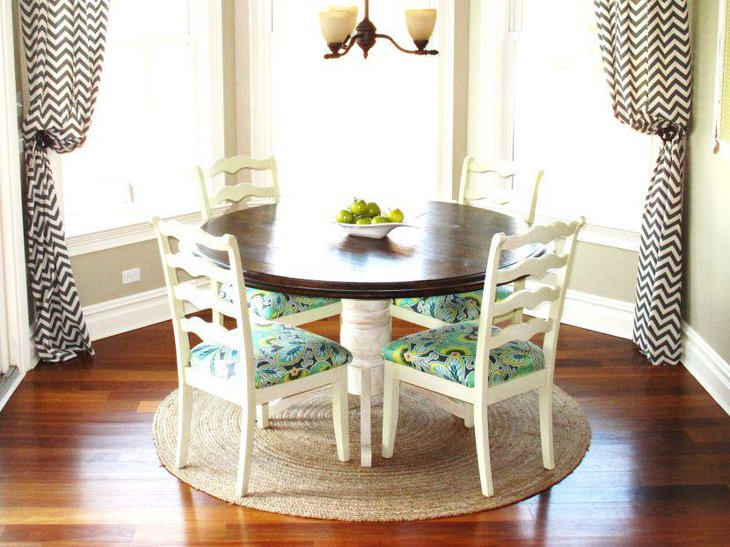 Small breakfast nook table with four chair seating arrangement