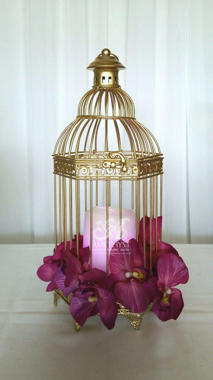 Small golden accented birdcage centerpiece