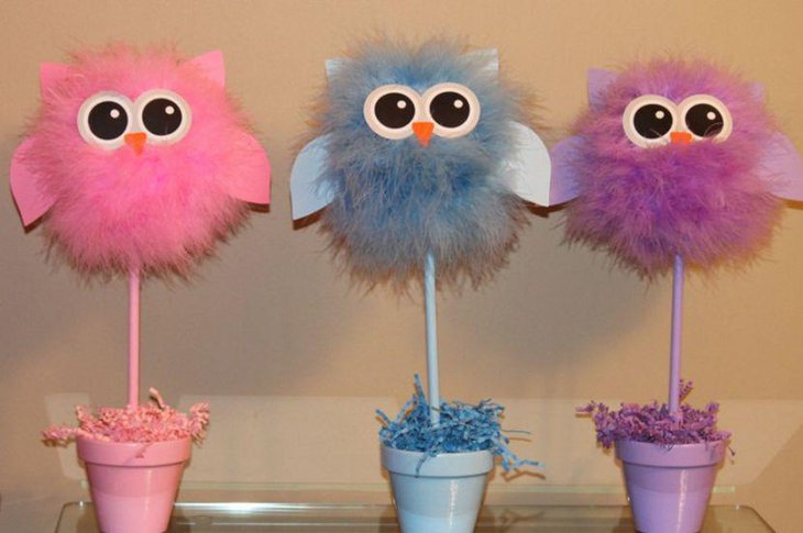 Soft owl centerpieces for a girl baby shower table