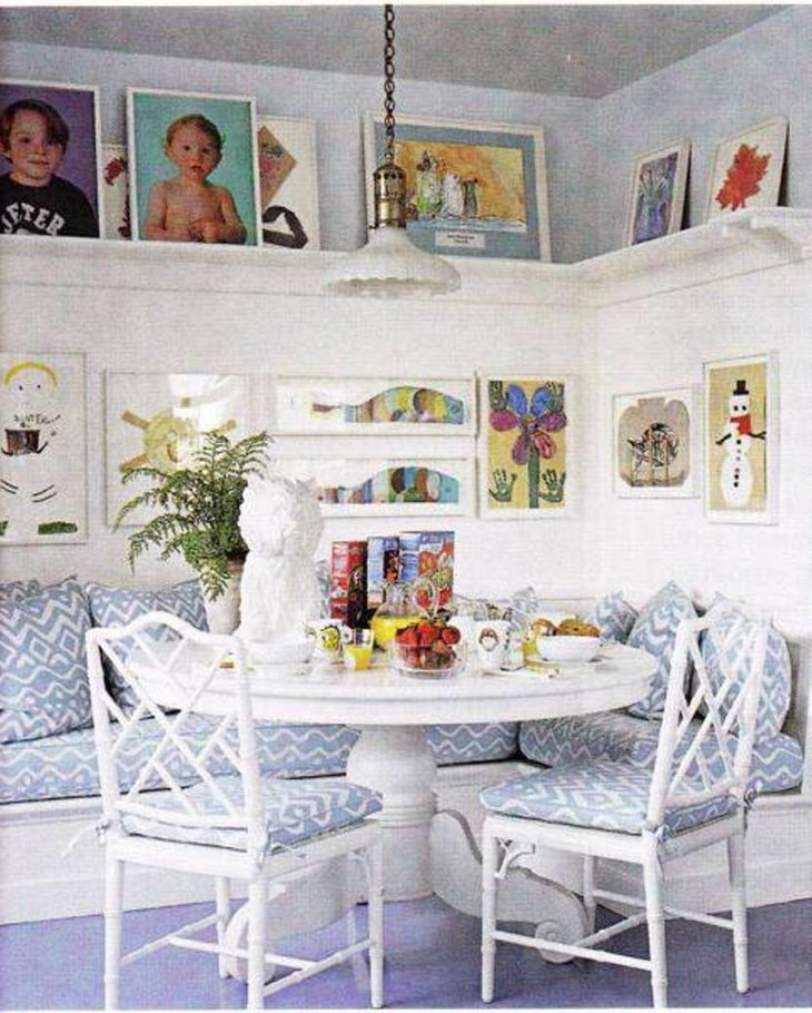 Soothing breakfast nook with open shelving and wall art