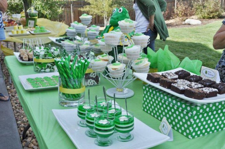 Soothing green dessert table with green colored desserts and eco friendly decoration