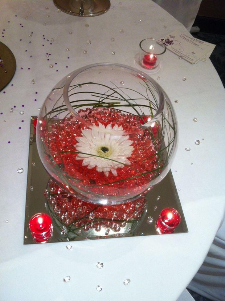 Stunning Fishbowl Wedding Table Centerpiece With Red Beads and Flower