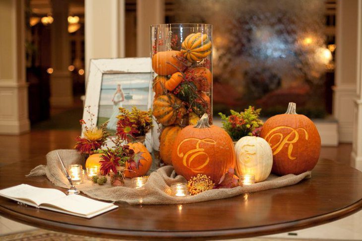 Stunning Halloween table decor with glass jar filled with small pumpkins