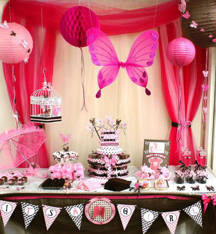 Stunning pink butterfly baby shower tablescape with brown accents