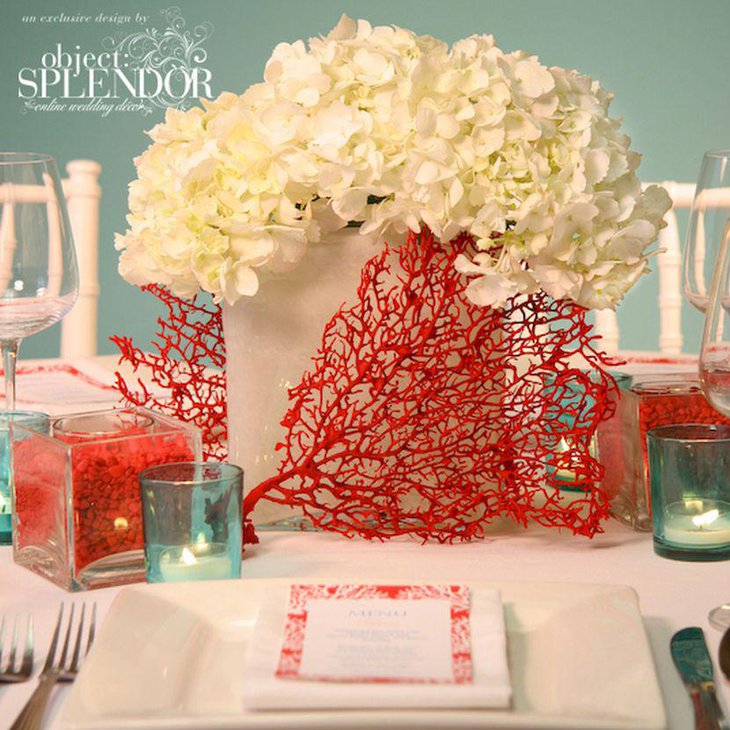 Stunning red coral and flower wedding table centerpiece