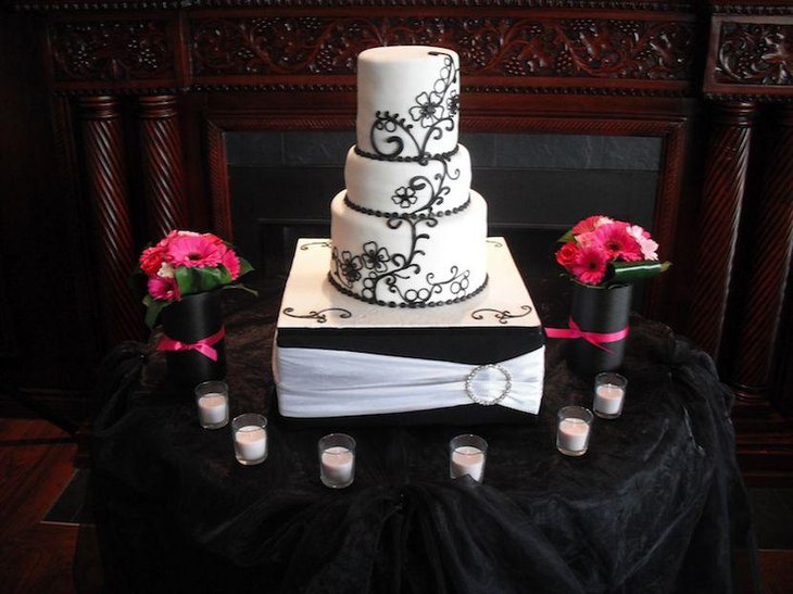 Stunning wedding cake table decor with black and white cake stand