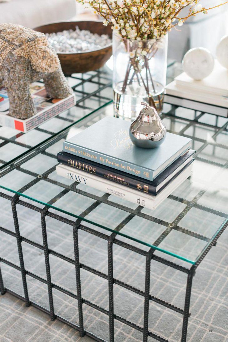Stylish book decor with silver pear on coffee table