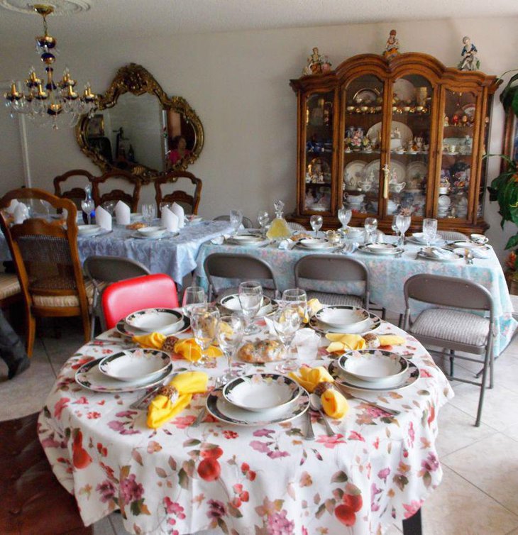 Stylish Italian decorations in yellow and floral tones seen on this table