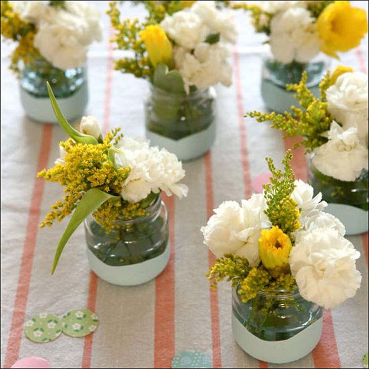 Summer garden party table decor with short glass vases