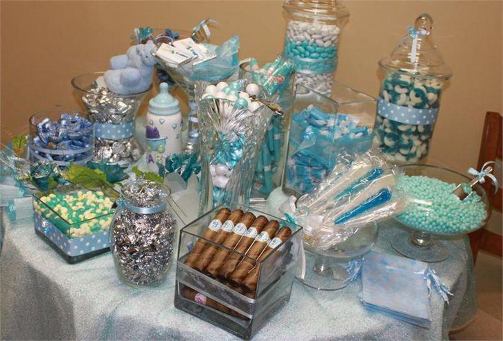 Sweet blue baby shower candy table decor with blue candy and baby bottle