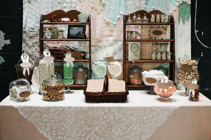 Sweet DIY wedding candy table idea with vintage jars labelled with craft paper and ribbon