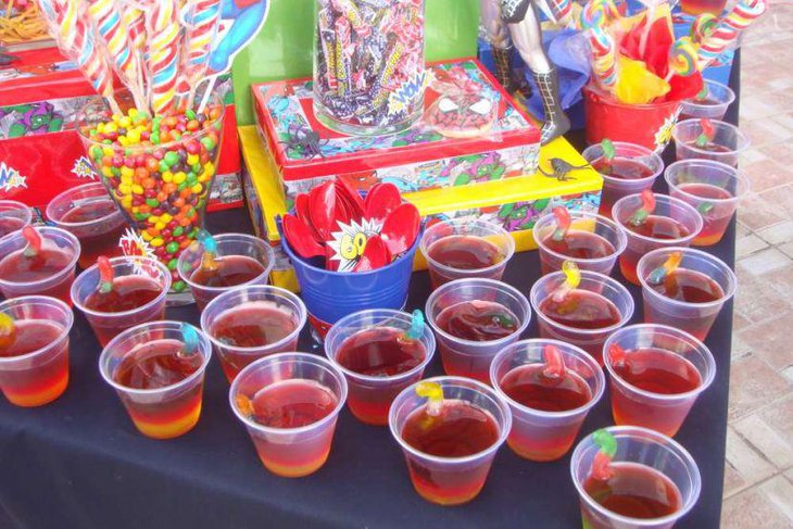 Table for drinks and candies for exciting Spiderman birthday party