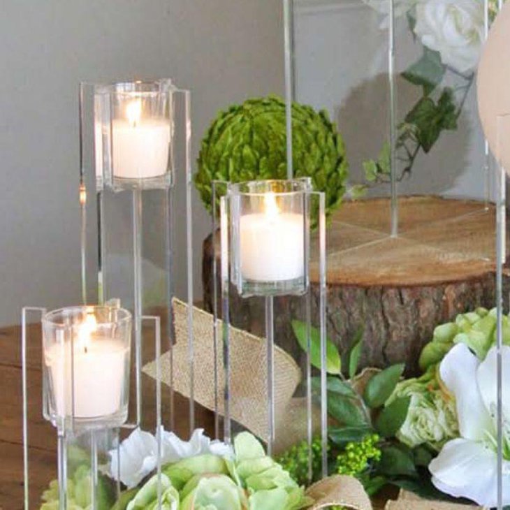 Tall acrylic votive candle centerpiece on wedding table