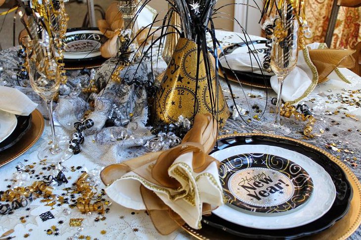 The Black White and Golden New Years Eve Celebration Party Table Decoration