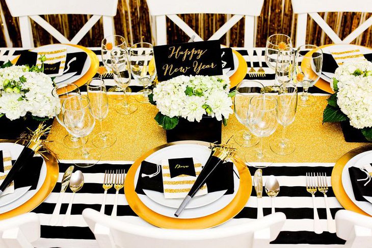 The Black White and Golden New Years Eve Flowery Party Table Decoration