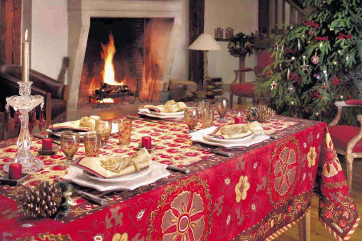This Christmas tablescape looks grand with a red patterned tablecloth