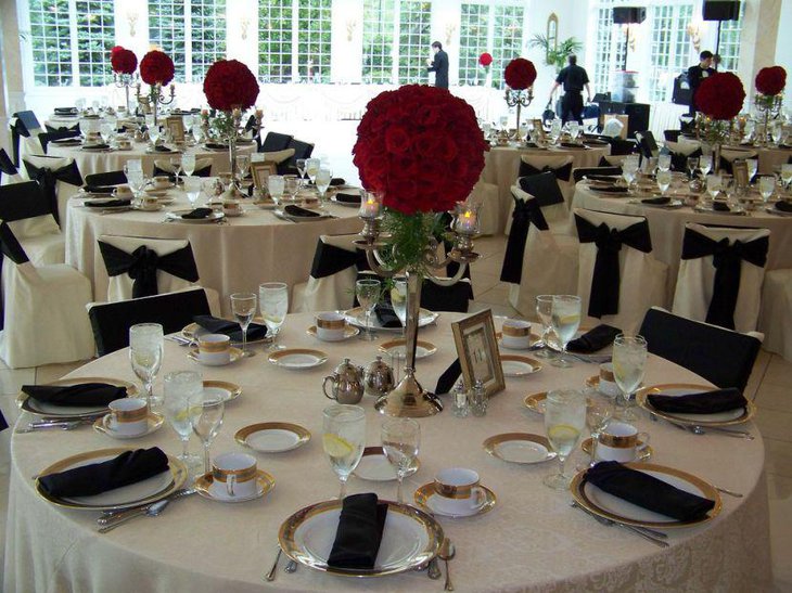 Topiary Centerpiece Decoration For Black And White Wedding Table With Gold Rimmed Frame And Cutlery