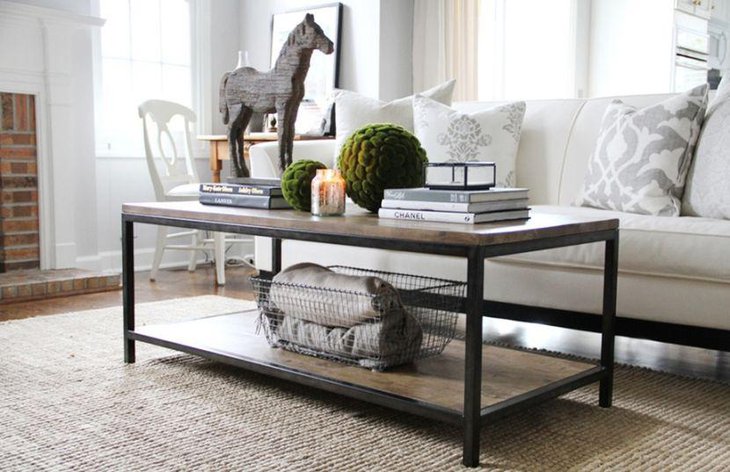 Unique coffee table setting with books and horse figurine