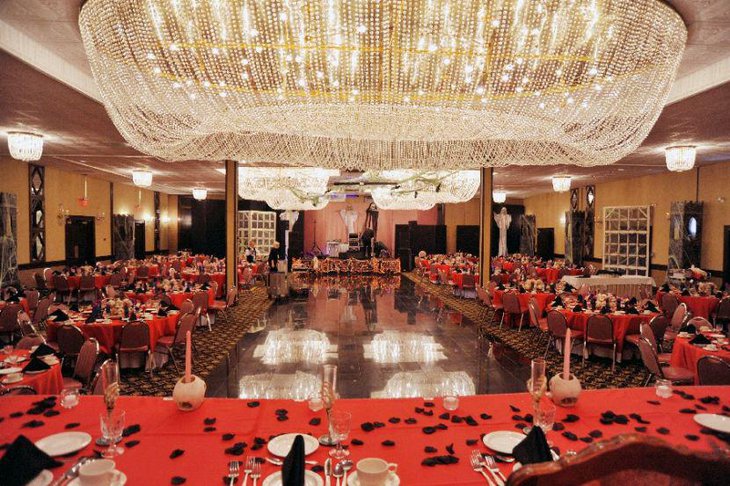 Unique wedding table setup with red and black theme