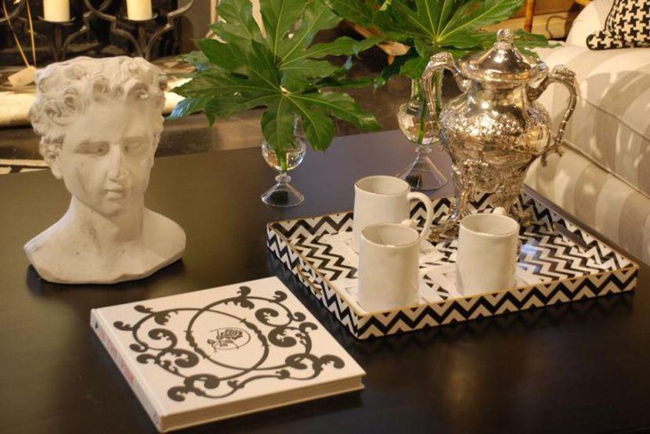 Unique white sculpture and printed tray as coffee table centerpieces