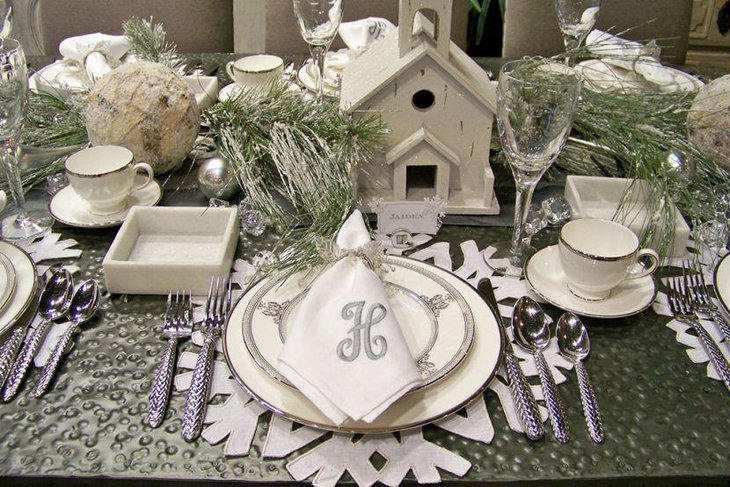 Unique winter table decoration with snowflake mats and place card holders