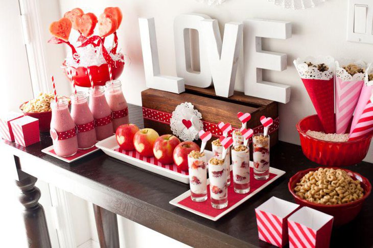 Valentines dessert table decor with heart lollipops
