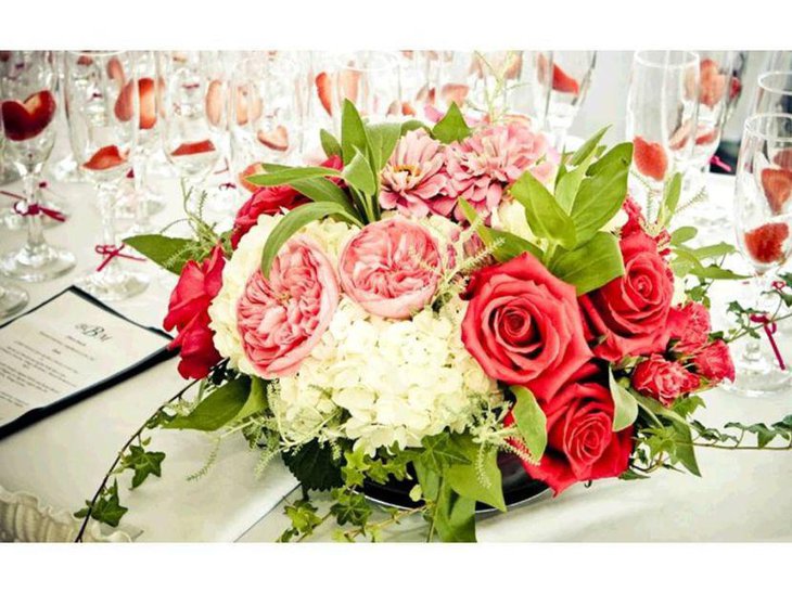 Vintage coral flower centerpiece on wedding table