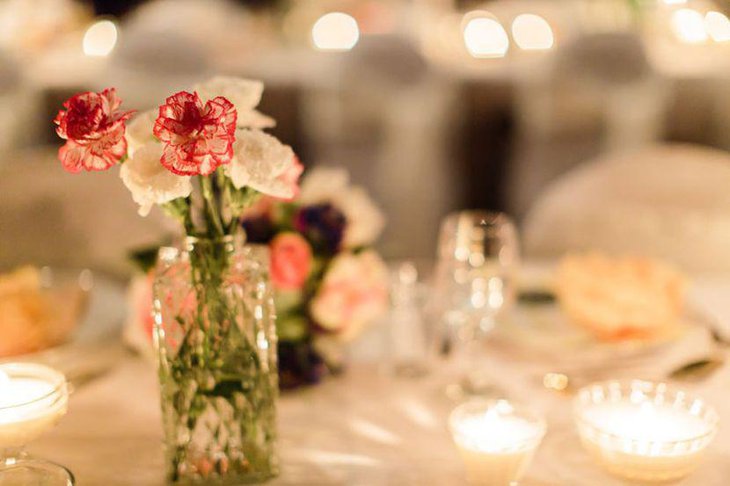 Vintage wedding table decor with floral vase