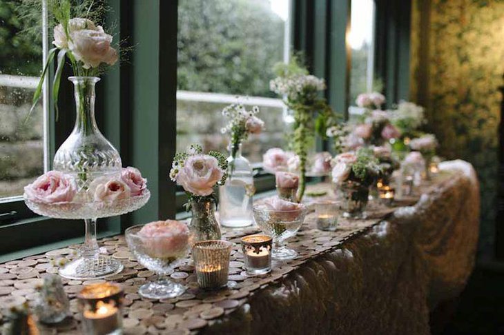 Vintage wedding table decor with glass vases