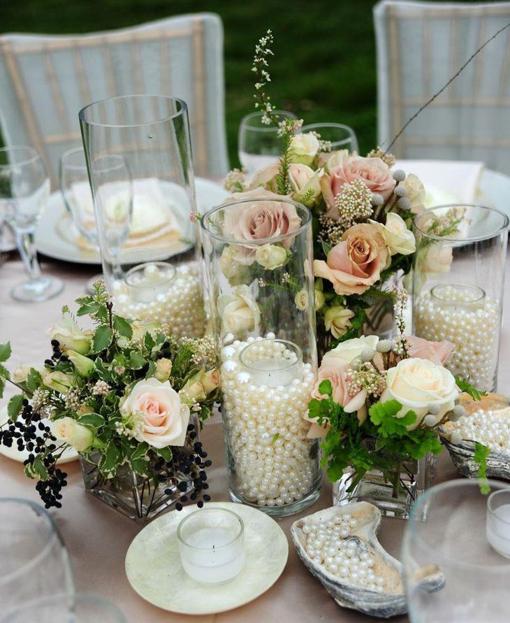 Vintage wedding table decor with jars filled with pearls