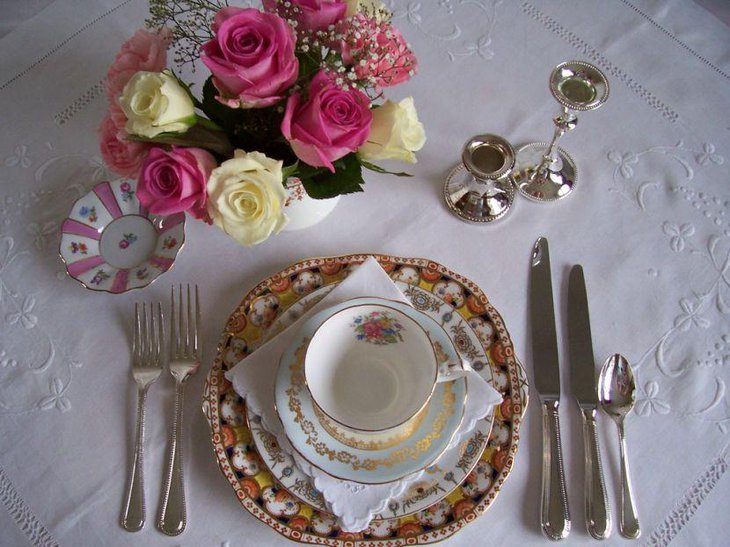 Vintage wedding table decoration with China teacups and saucers