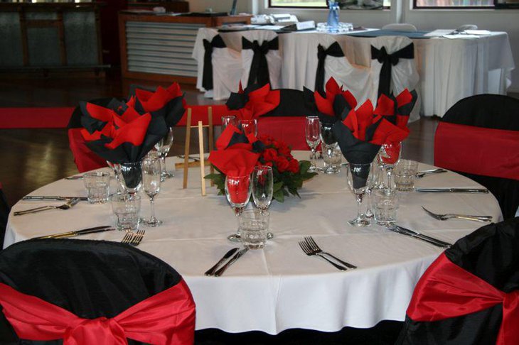 Wedding reception decor with black white and red accents